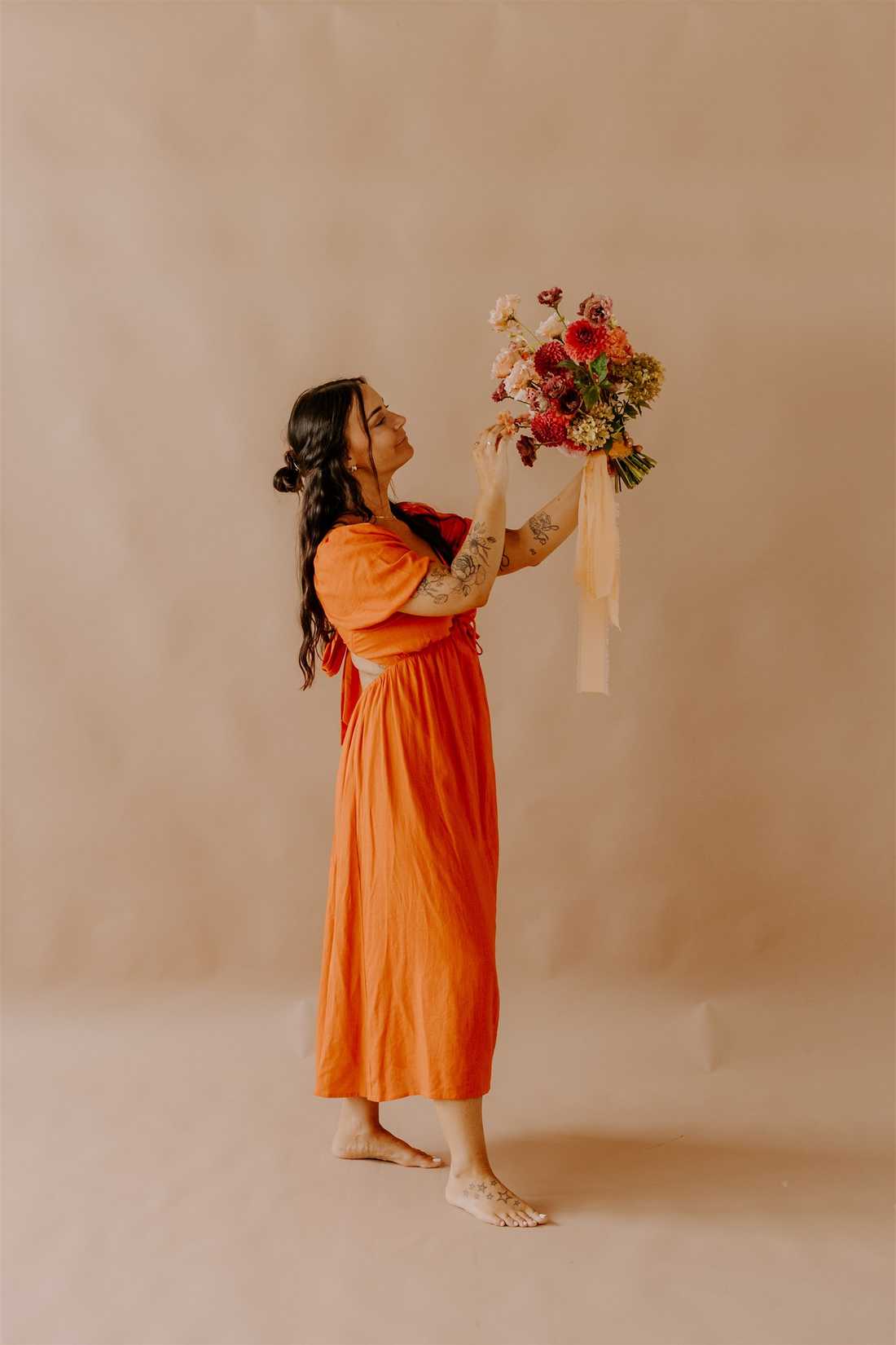 Sarina holding a bouquet of flowers
